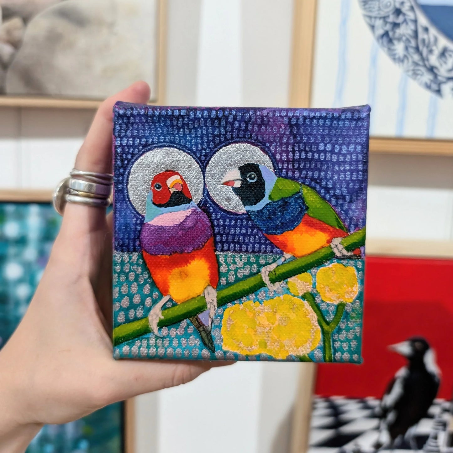 Finch lovers with golden halos