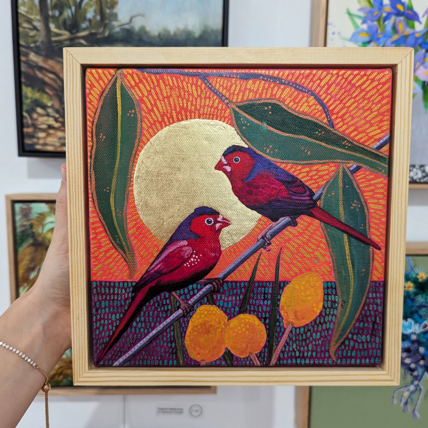 Red couple and Billy Buttons in a golden sun