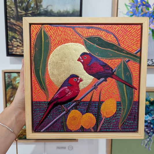 Red couple and Billy Buttons in a golden sun