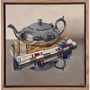 Silver Teapot and Tea Towel Stack