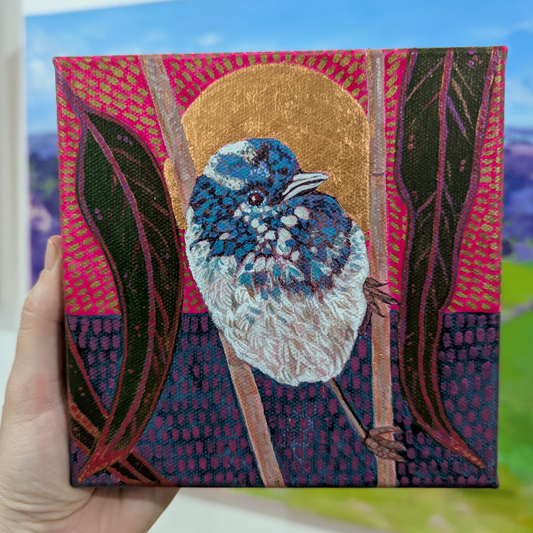 Mr Wren in grass under a rose gold sun