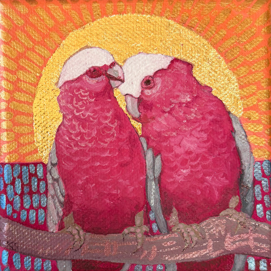 Pink couple under a gold sun